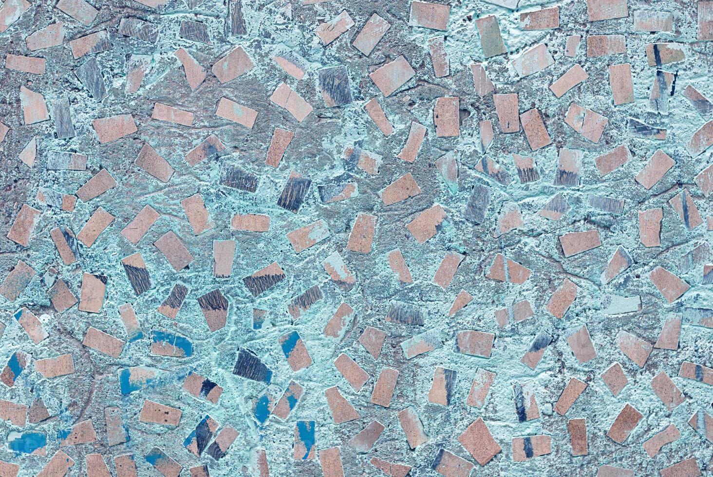 abstract texture of concrete wall with random mosaic pattern photo