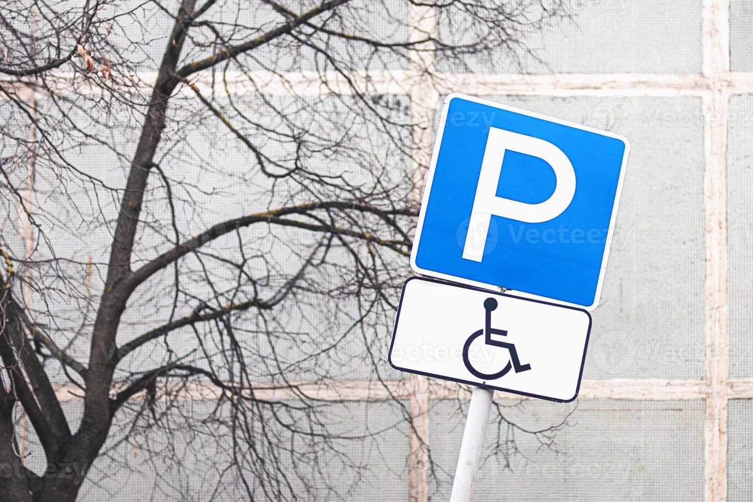 Parking place for drivers with disabilities in residential area photo