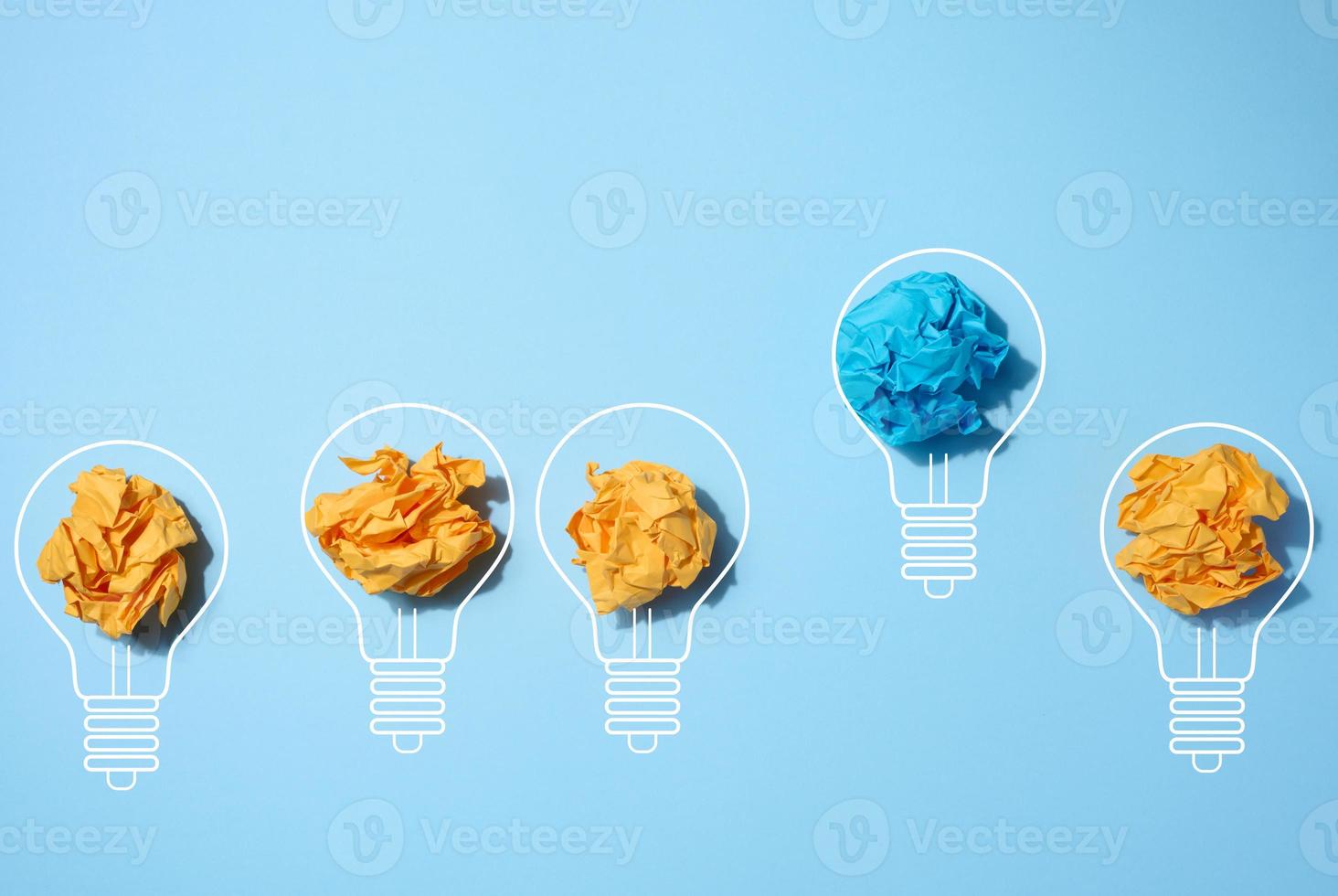 Crumpled paper sheets inside a drawn light bulb, concept of new creative idea, innovation photo