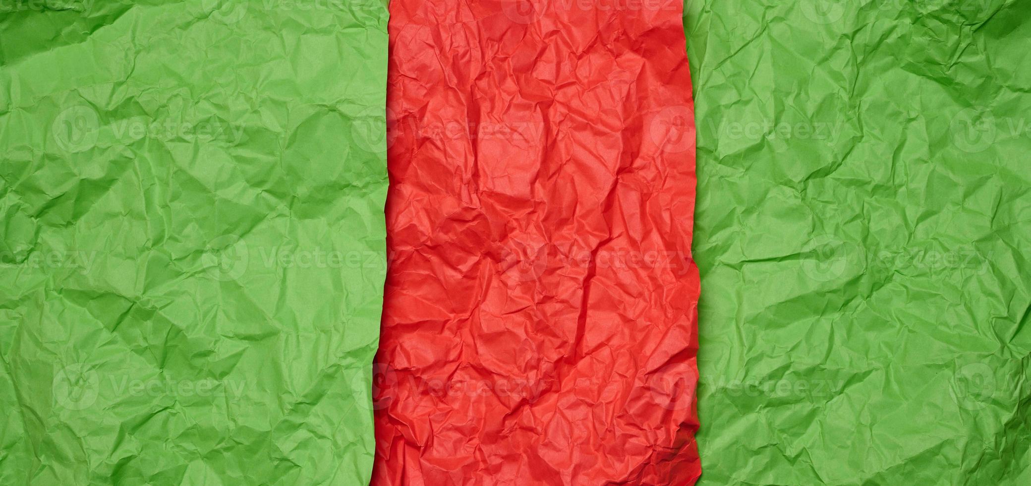 Crumpled red and green paper sheets, paper texture. Background for designers photo