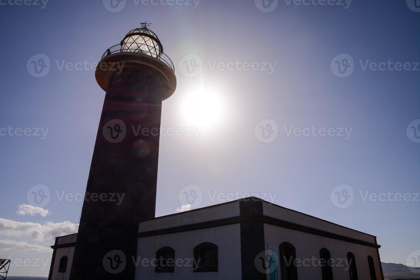 Lighthouse by the sea photo