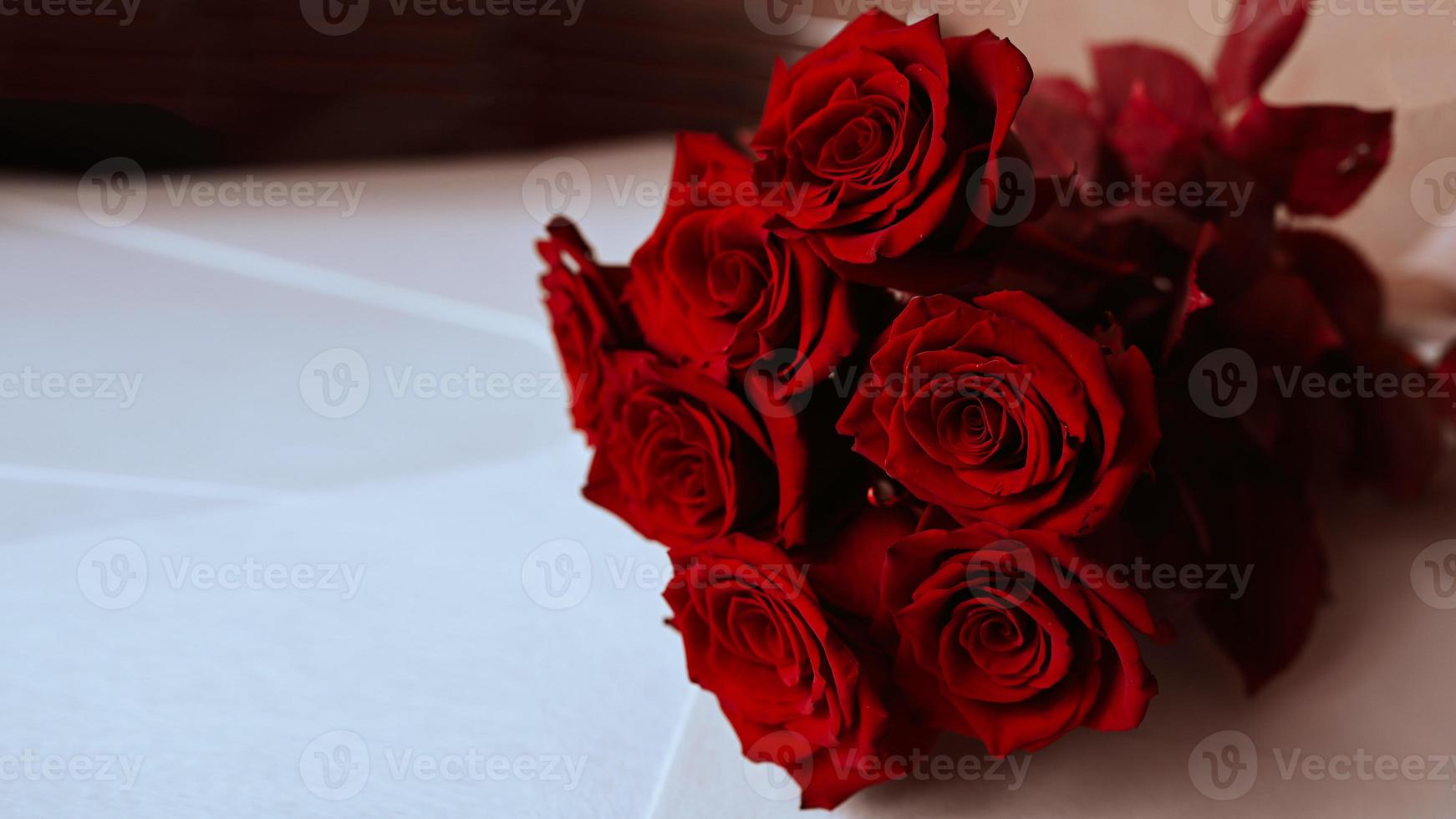 Wallpaper with red roses. Amazing background with red leaves for greeting card, invitation. Lots of red natural amazing roses. photo