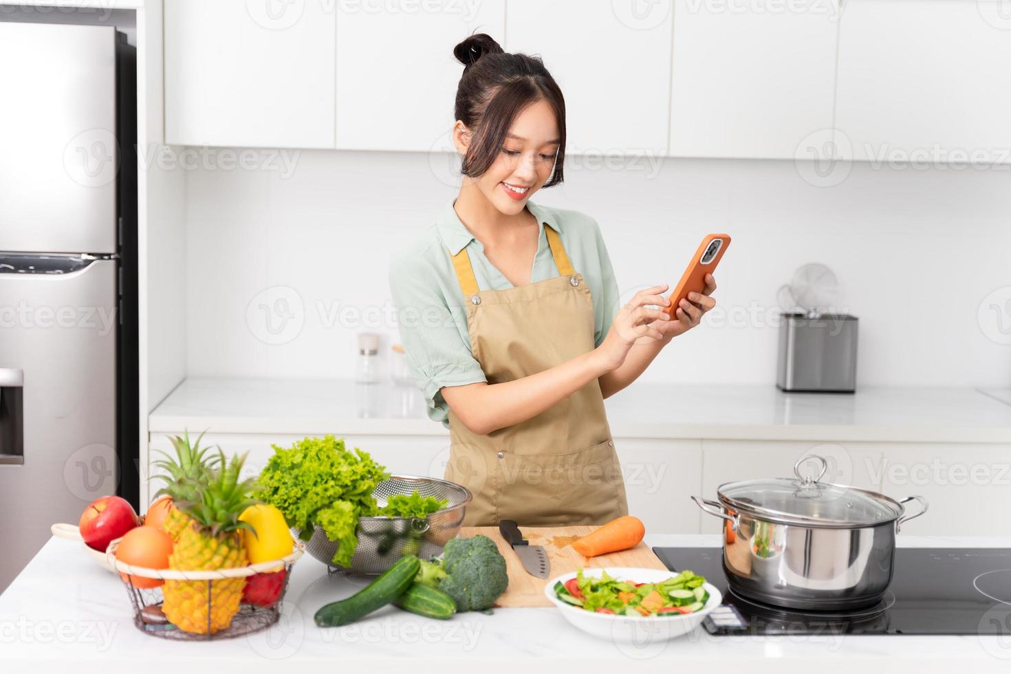 Portrait of a housewife in the kitchen at home photo