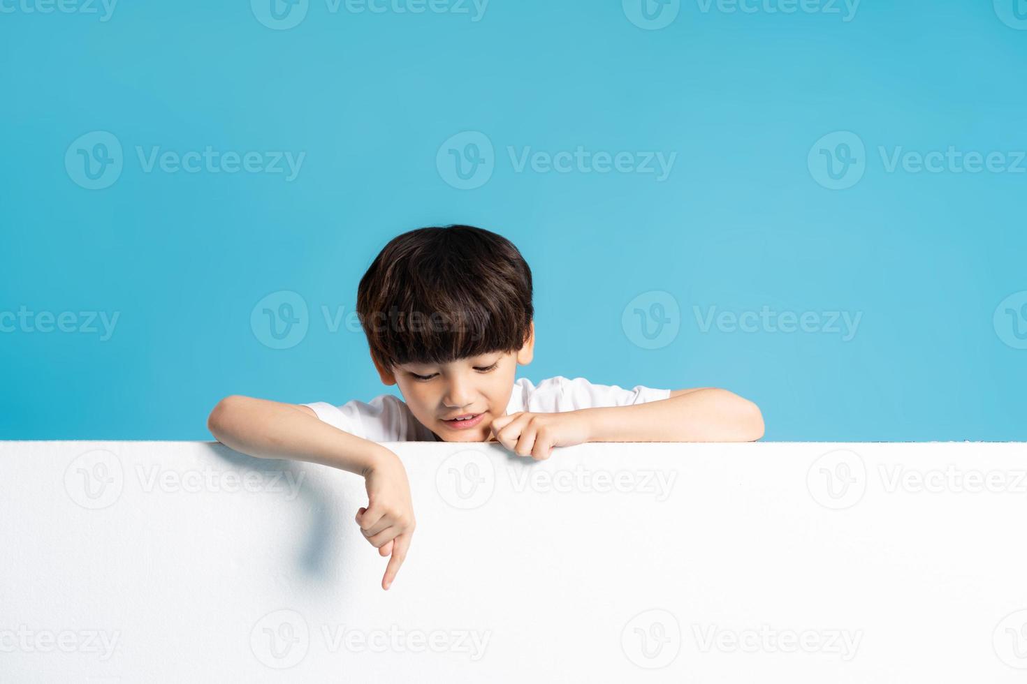 Asian boy portrait on blue background photo