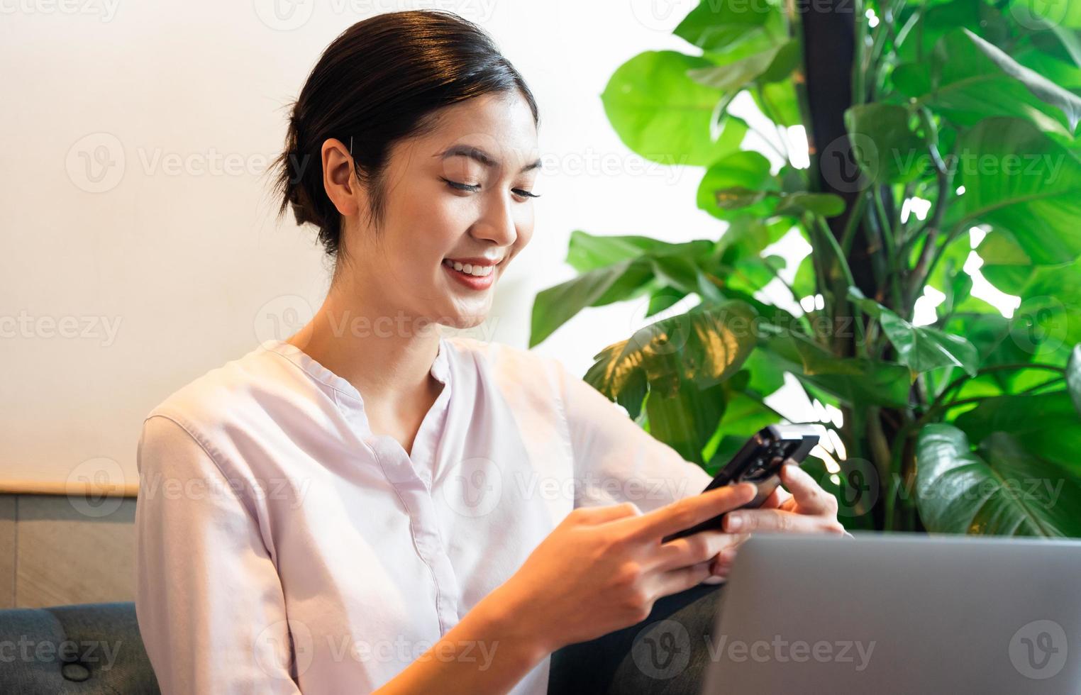 Portrait of beautiful asian woman sitting at cafe photo