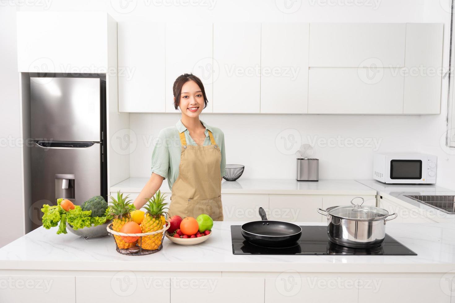 Portrait of a housewife in the kitchen at home photo
