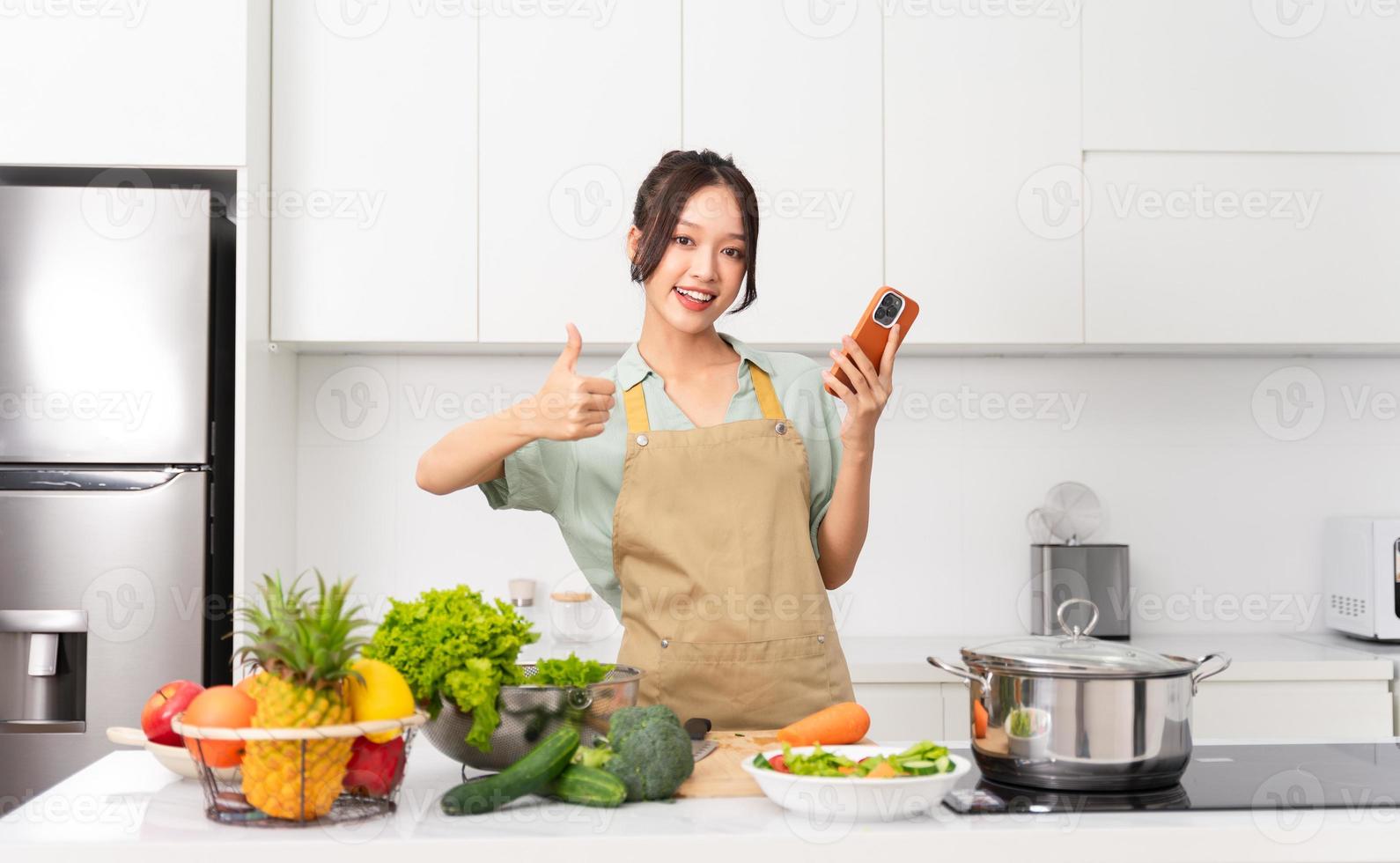 Portrait of a housewife in the kitchen at home photo