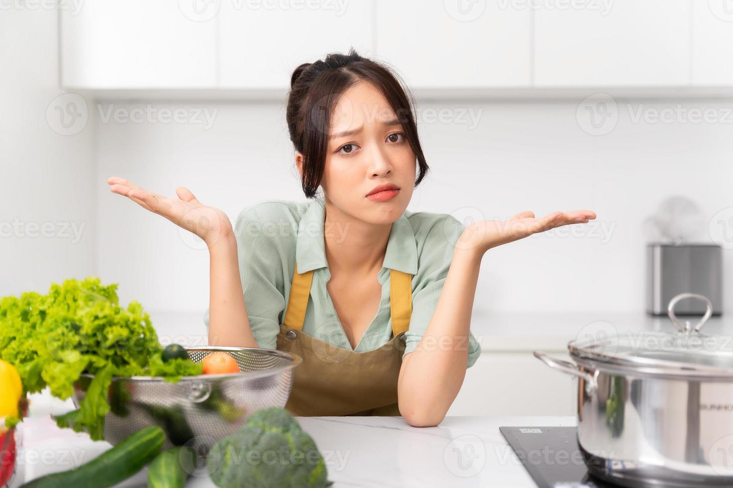 Portrait of a housewife in the kitchen at home photo