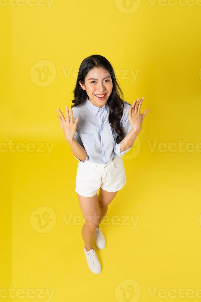 image of asian woman on a yellow background photo