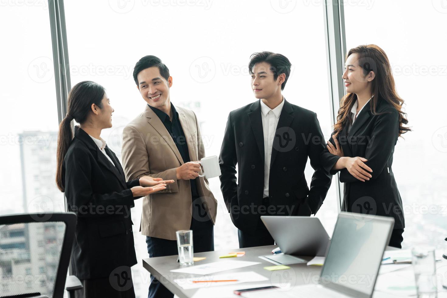 image of a group of Asian businessmen working together at the company photo