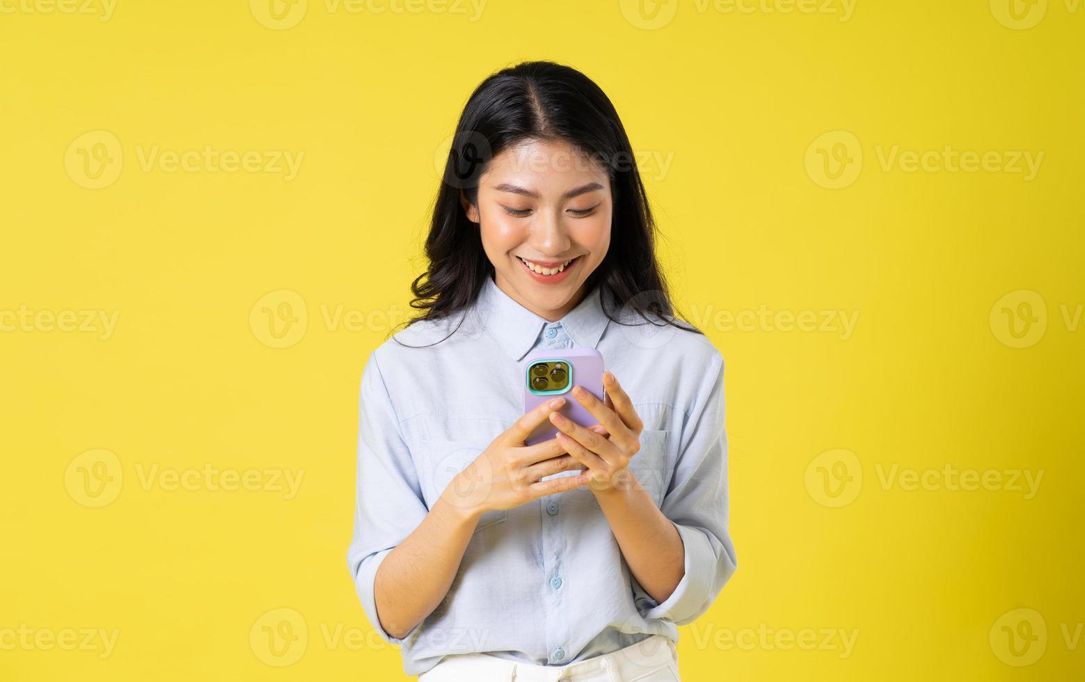 Asian woman on yellow background photo