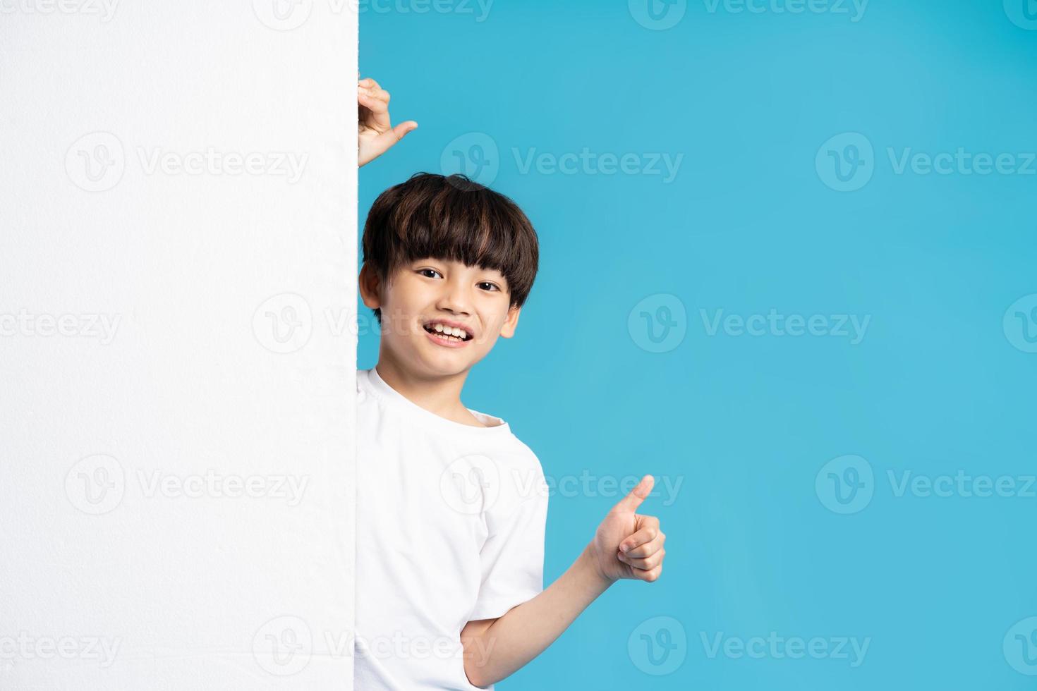 Asian boy portrait on blue background photo