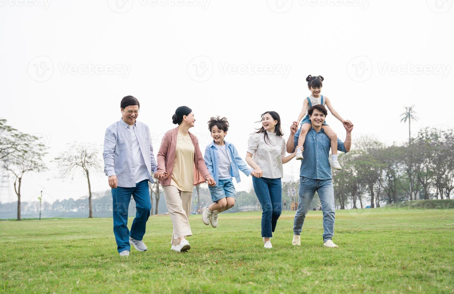 Asian family photo walking together in the park