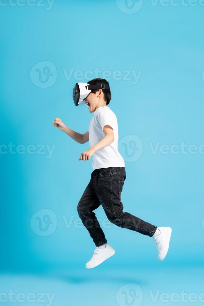 Asian boy portrait on blue background photo