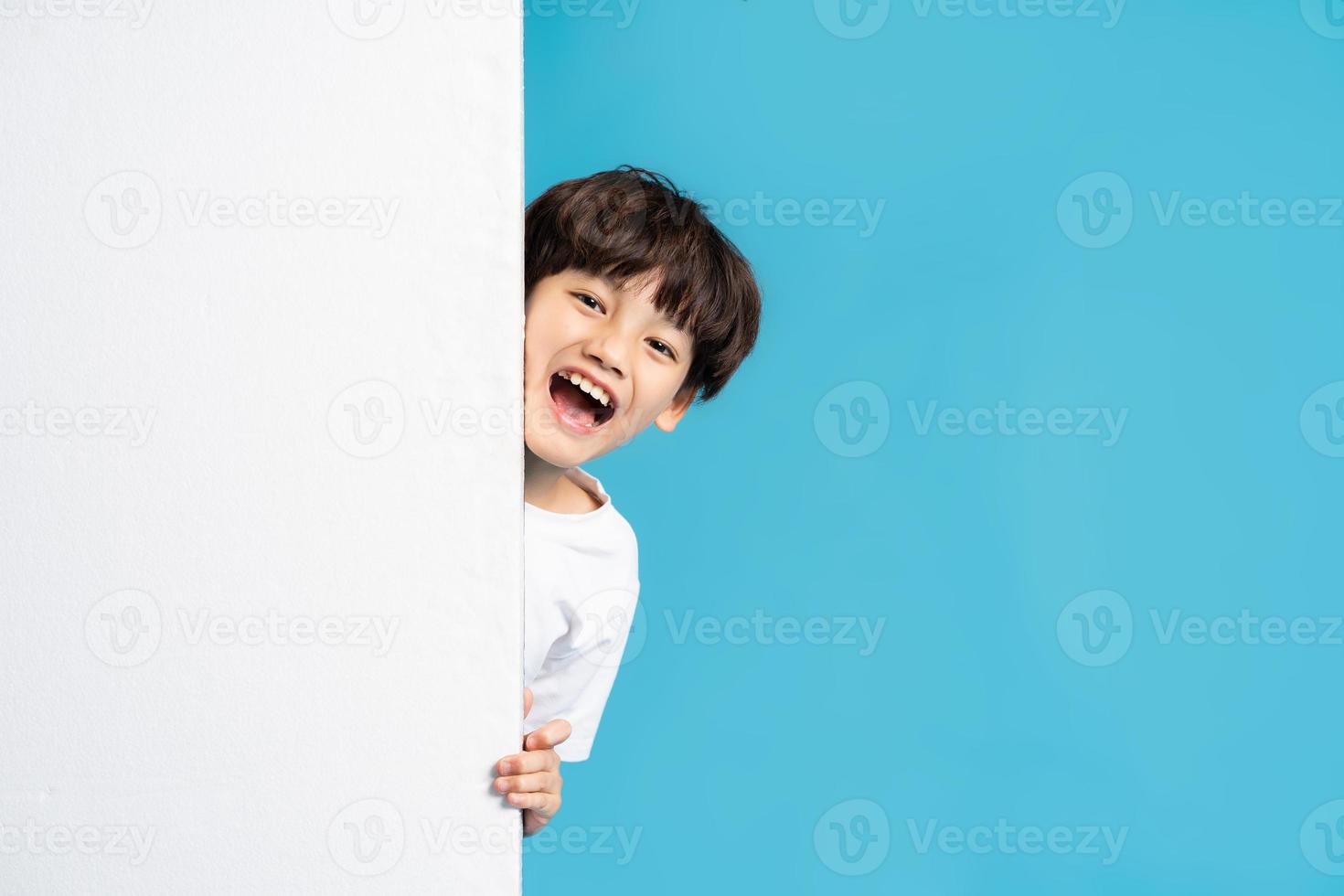 Asian boy portrait on blue background photo