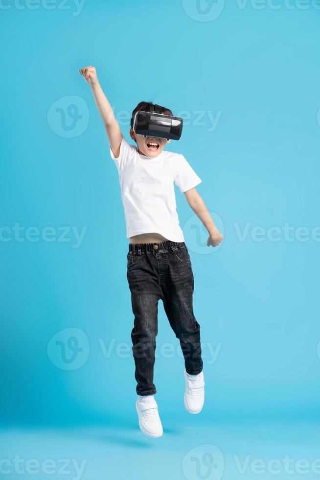 Asian boy portrait on blue background photo