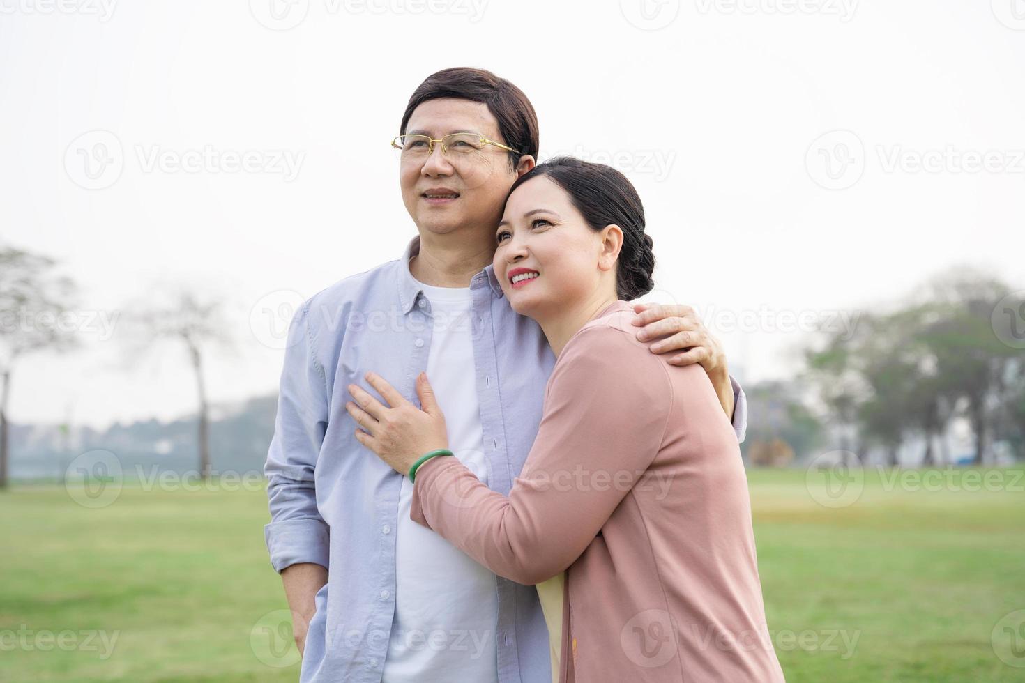 Elderly Asian couple in the park photo