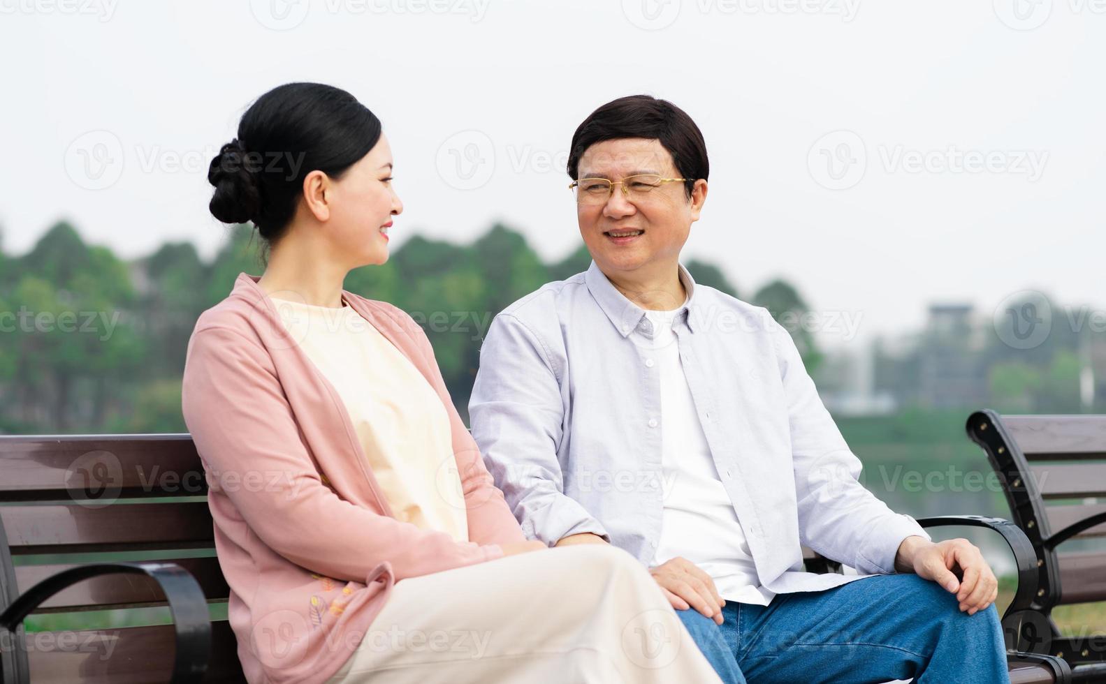 Elderly Asian couple in the park photo