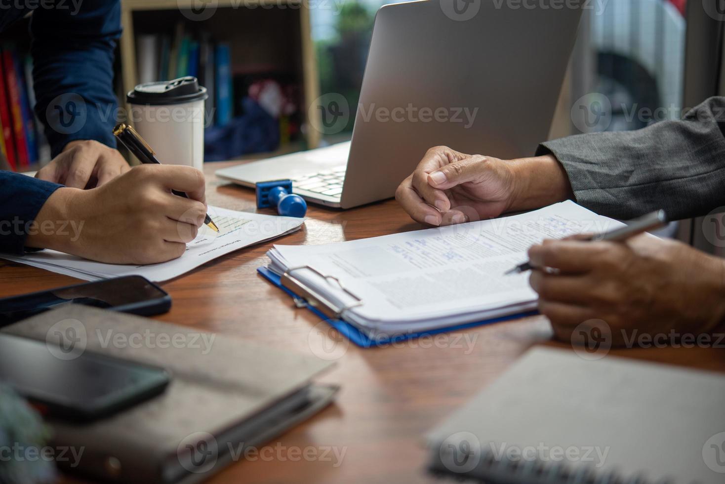 manager or hr reading a resume during a job interview of employees who apply for jobs Application. photo
