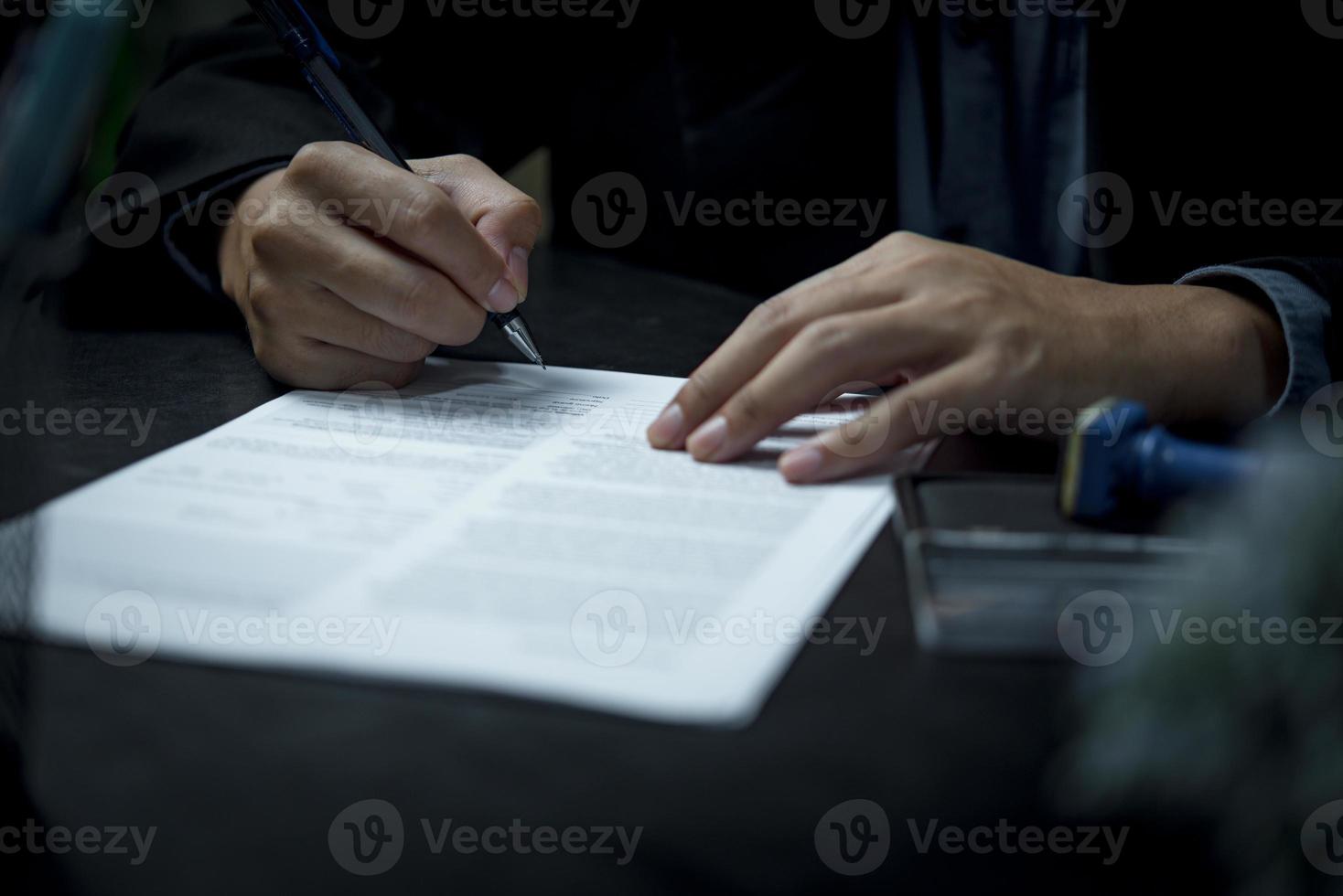 businessman agree to make deal signing document, sale contract or legal transaction contract at desk photo