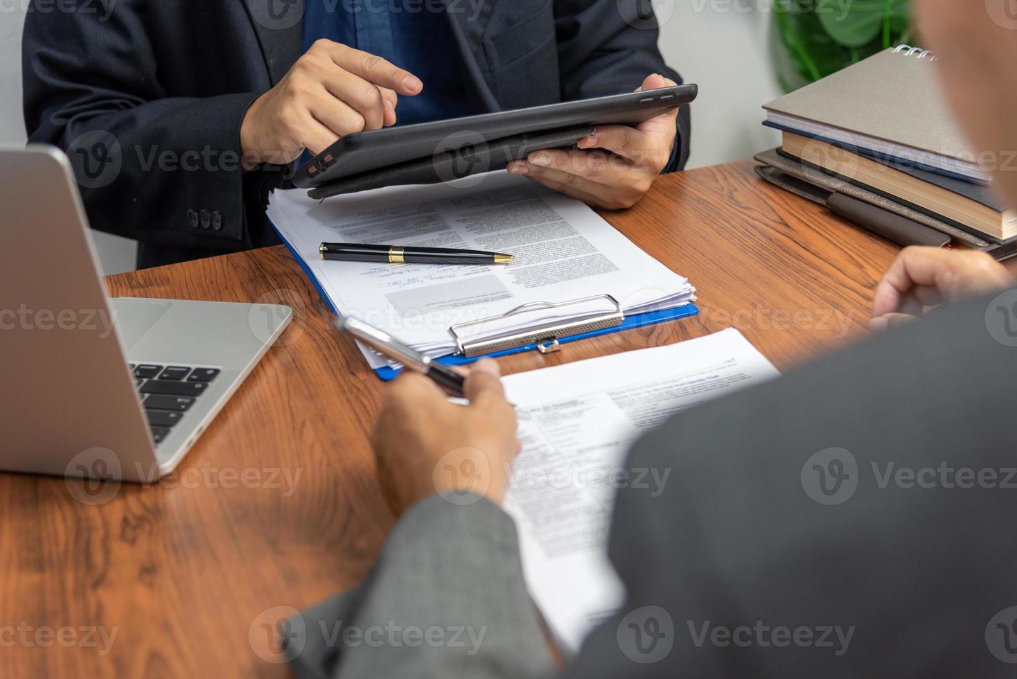 manager or hr reading a resume during a job interview of employees who apply for jobs Application. photo
