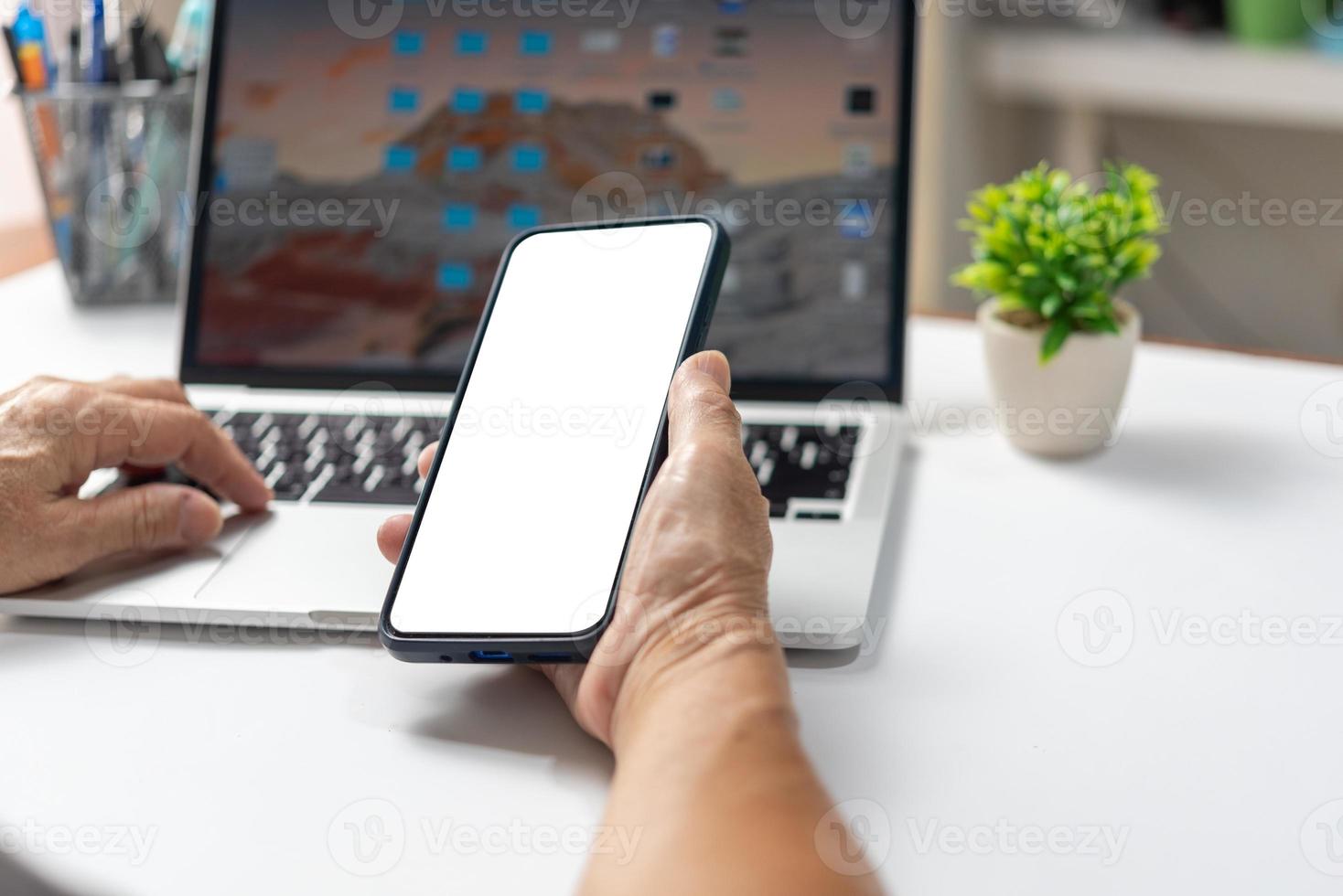 Woman hands holding smart phone mock up with blank copy space screen for your text message or information content. photo