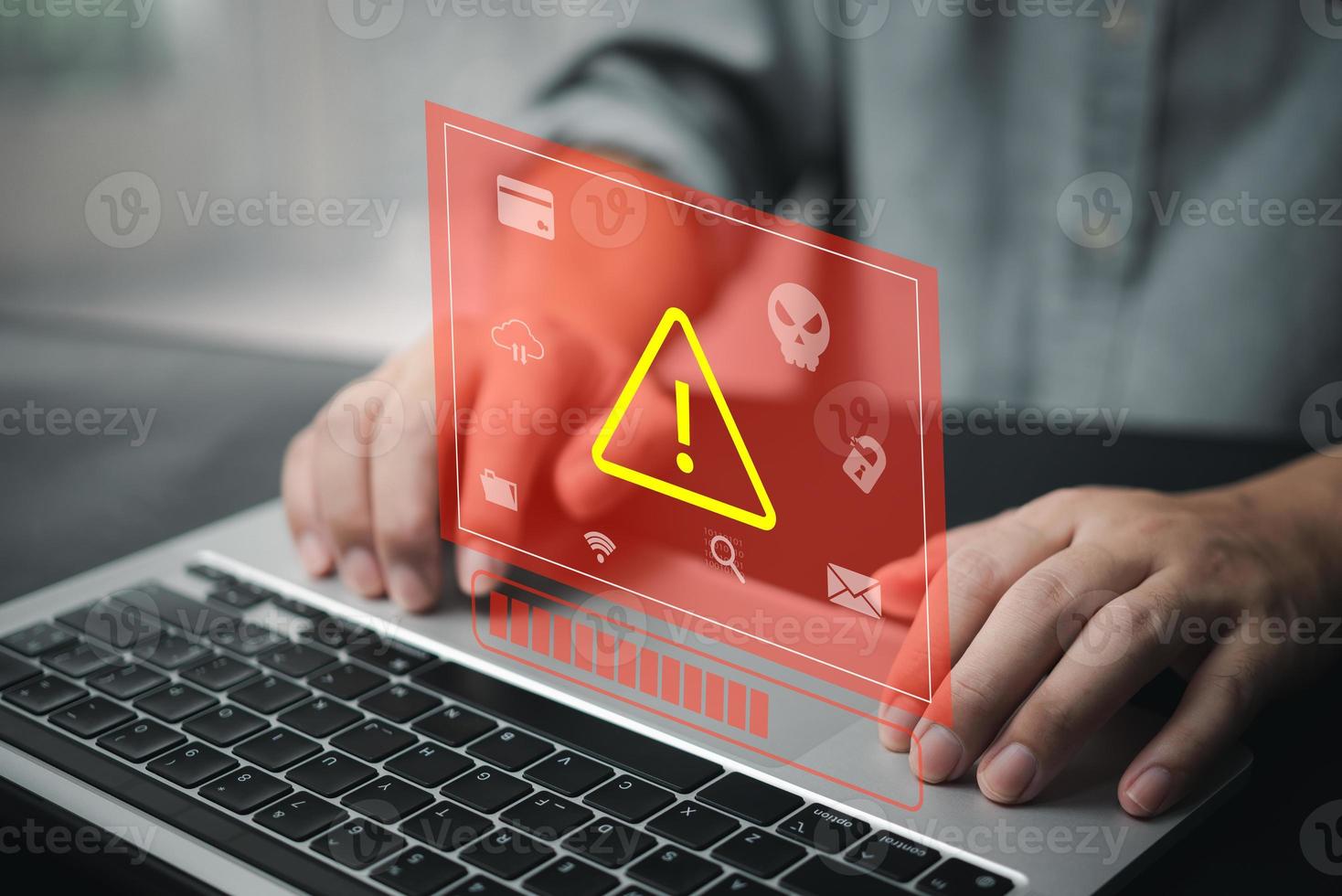 Businessman programmer, developer using laptop computer with triangle caution warning sign. system hacked on computer network cybersecurity vulnerability. photo