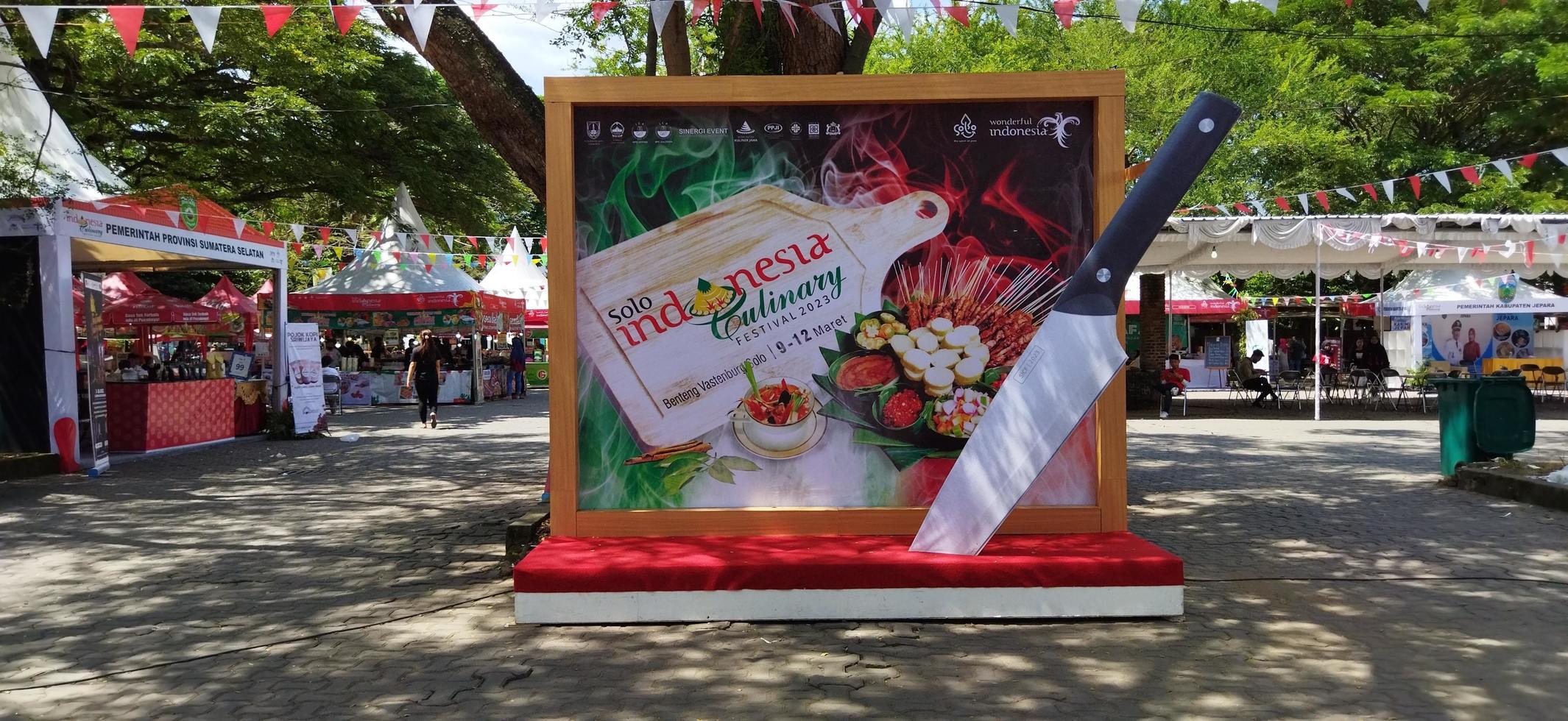 Surakarta, Indonesia, March 12, 2023. Visitors gather around vendor booths for a taste of some foods, an outdoor culinary and arts festival held one in summer on Benteng Vastenburg. photo