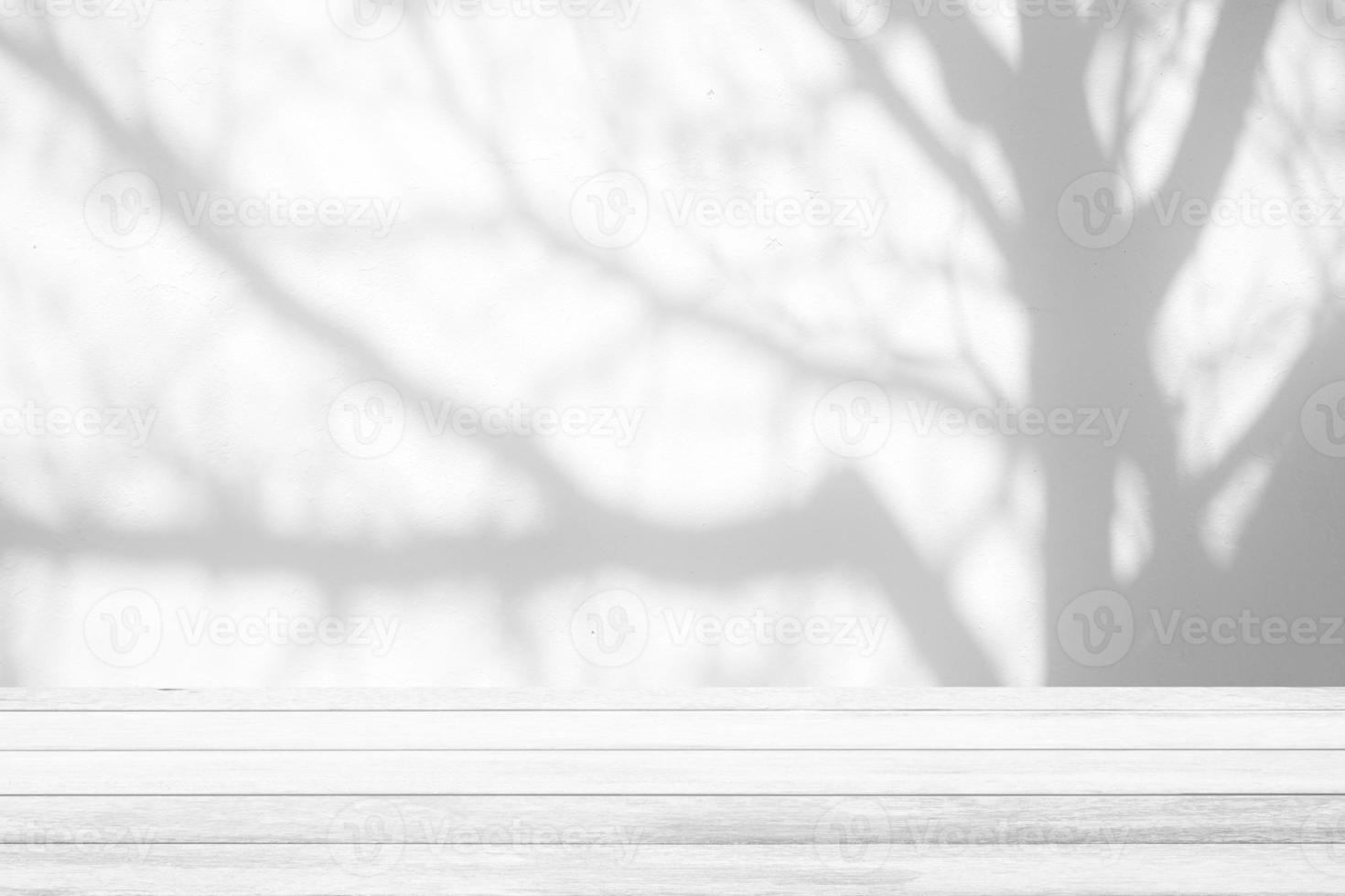 White Wood Table with Tree Shadow on Concrete Wall Texture Background, Suitable for Product Presentation Backdrop, Display, and Mock up. photo