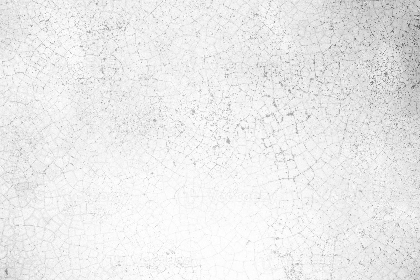 White Cracked Concrete Wall Texture Background with Light Leak from the Right. photo