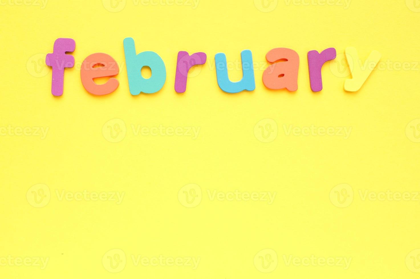 Calendar february list, daily planner for wall and desk on yellow background. To do, check list. Organizer, notebook with copy space. Business concept. Plan, action text. Schedule for month photo