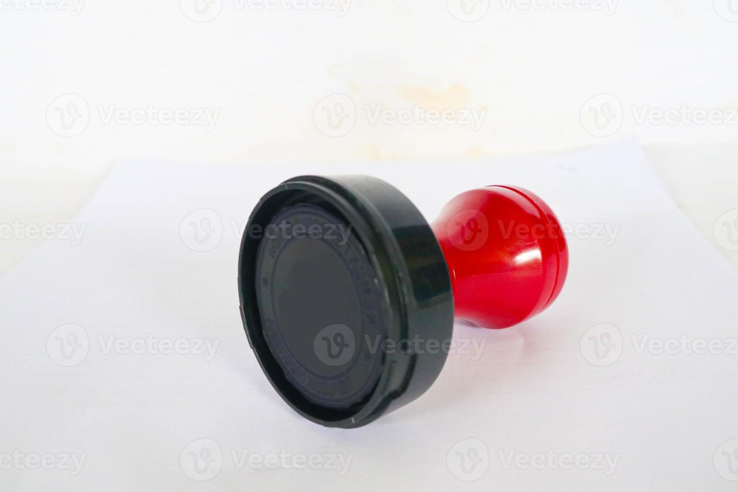 Stamp, modern Stamp, Red Handle Rubber Stamp Top View Isolated on White Background. photo