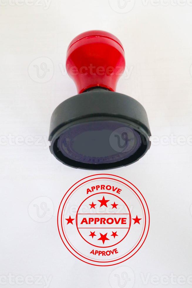 Stamp, modern Stamp, Red Handle Rubber Stamp Top View Isolated on White Background. photo