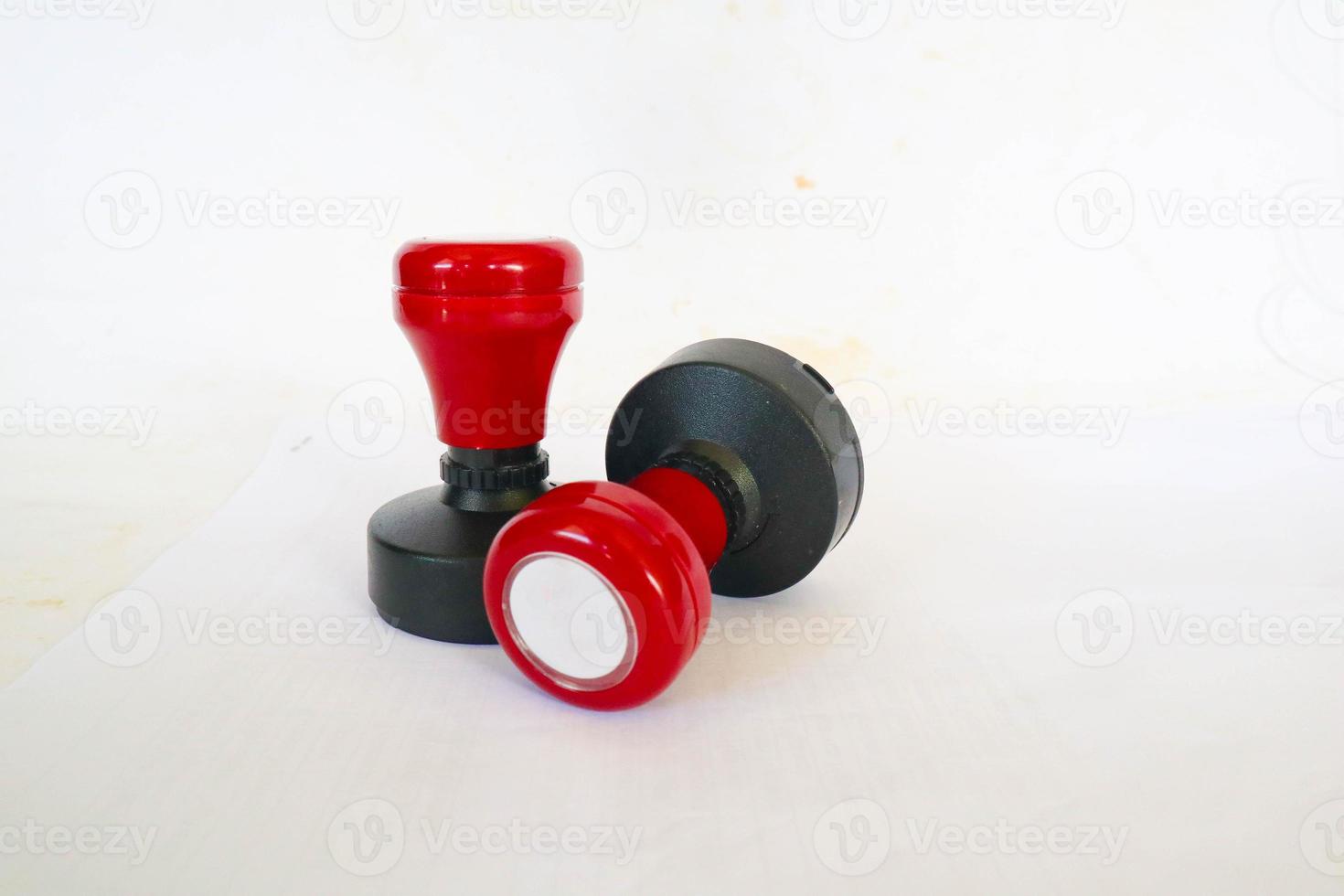 Stamp, modern Stamp, Red Handle Rubber Stamp Top View Isolated on White Background. photo