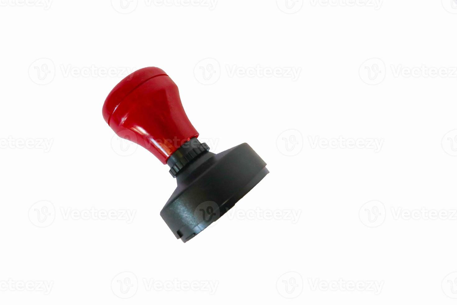 Stamp, modern Stamp, Red Handle Rubber Stamp Top View Isolated on White Background. photo