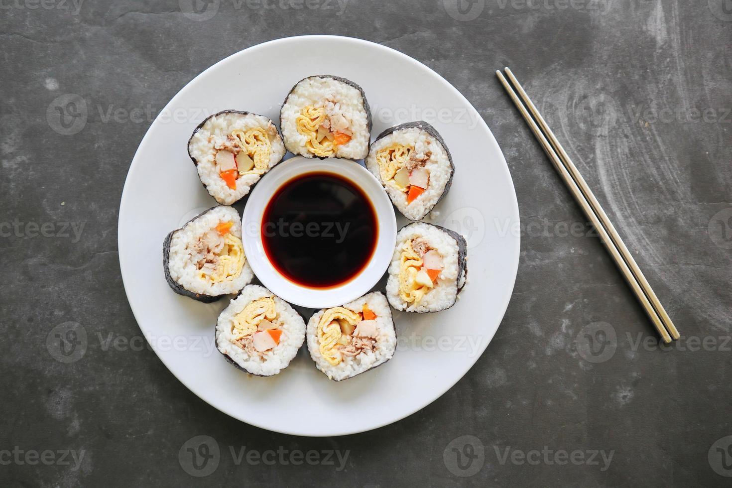 kimbap or gimbap is Korean roll made from steamed white rice  and various other ingredients, this food from south korea photo