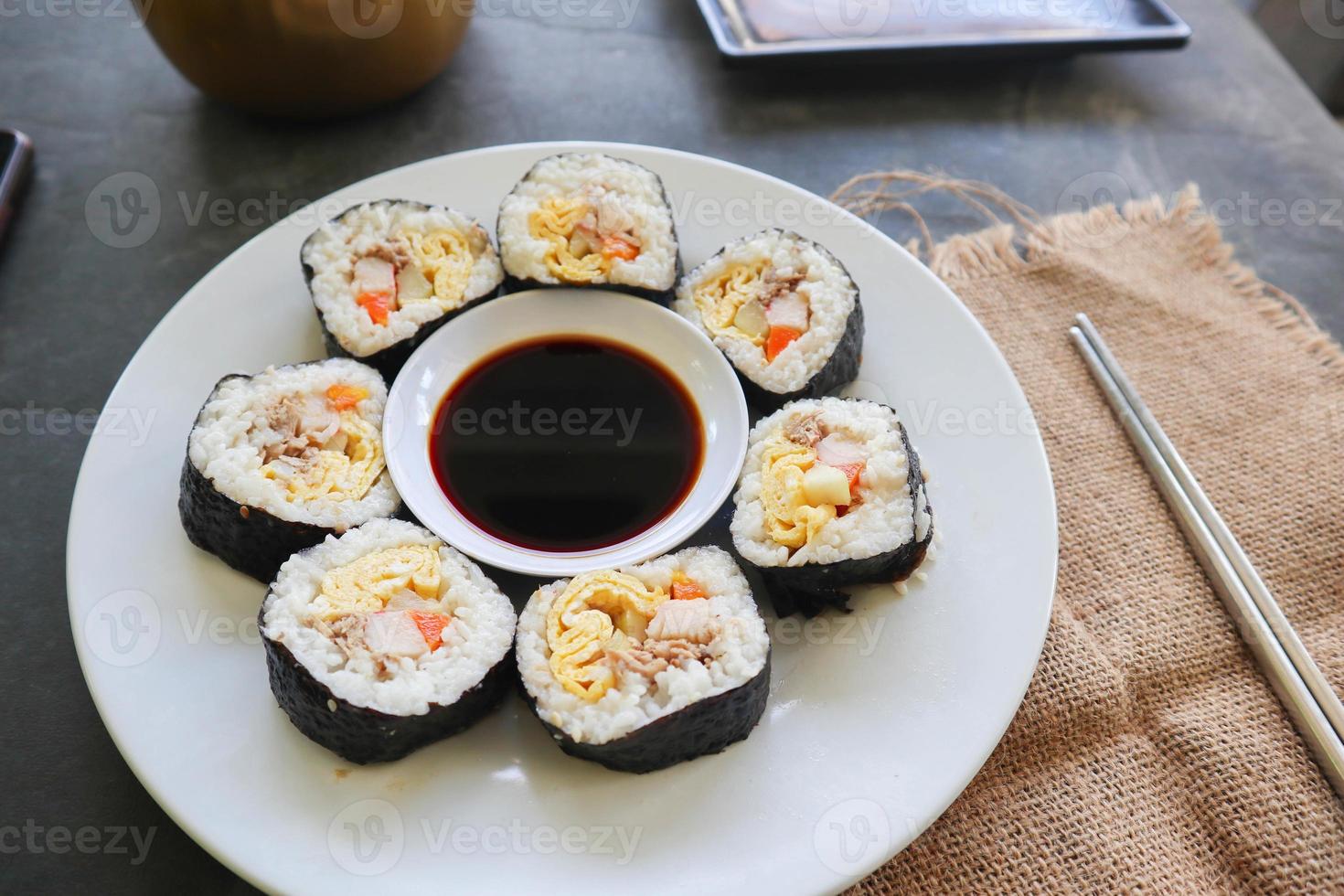 kimbap or gimbap is Korean roll made from steamed white rice  and various other ingredients, this food from south korea photo