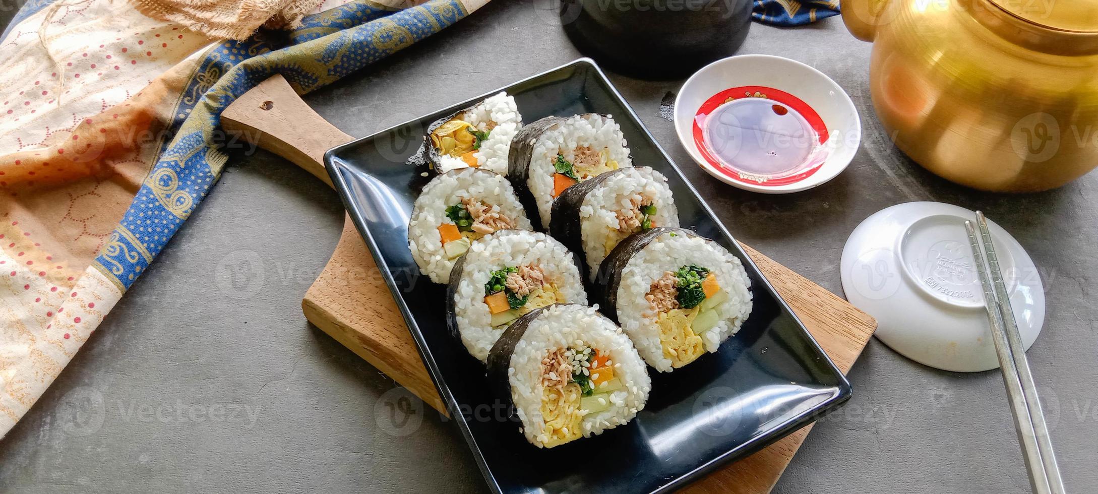 kimbap or gimbap is Korean roll Gimbap, kimbob made from steamed white rice bap and various other ingredients, this food from south korea photo