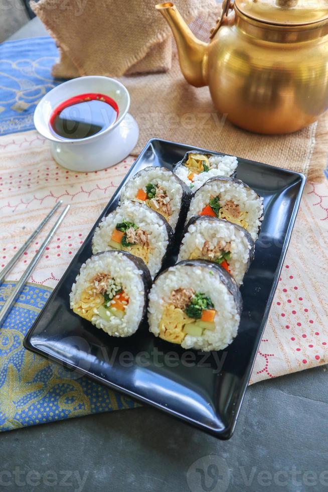 kimbap or gimbap is Korean roll Gimbap, kimbob made from steamed white rice bap and various other ingredients, this food from south korea photo