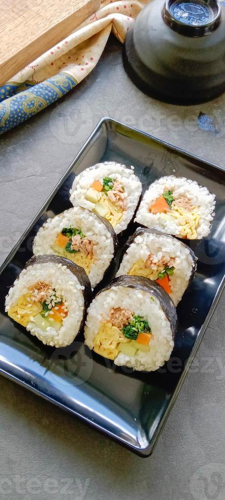 kimbap or gimbap is Korean roll Gimbap, kimbob made from steamed white rice bap and various other ingredients, this food from south korea photo