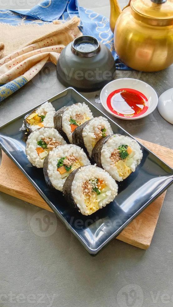 kimbap or gimbap is Korean roll Gimbap, kimbob made from steamed white rice bap and various other ingredients, this food from south korea photo