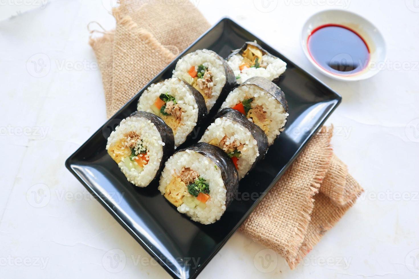 kimbap or gimbap is Korean roll Gimbap, kimbob made from steamed white rice bap and various other ingredients, this food from south korea photo