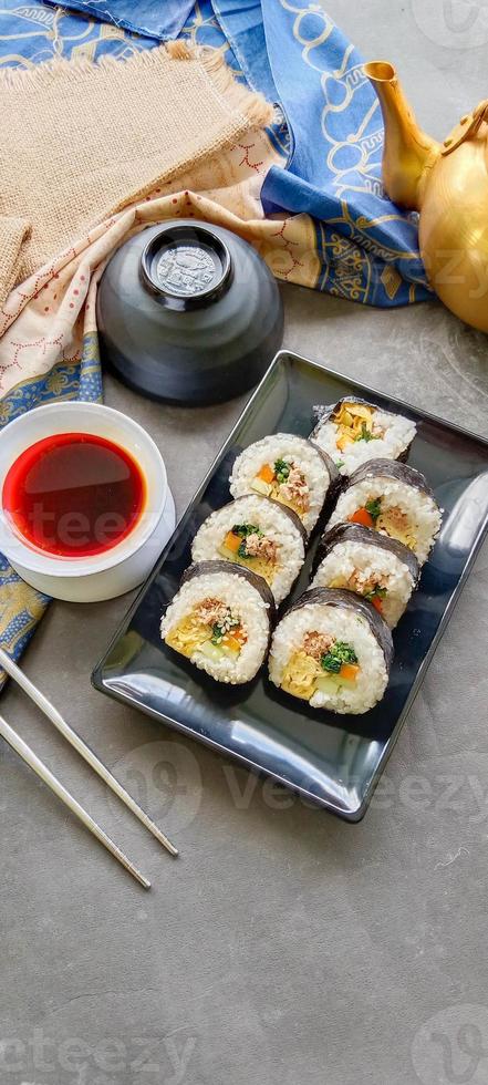 kimbap or gimbap is Korean roll Gimbap, kimbob made from steamed white rice bap and various other ingredients, this food from south korea photo