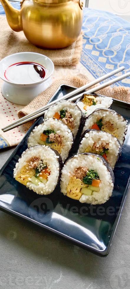 kimbap or gimbap is Korean roll Gimbap, kimbob made from steamed white rice bap and various other ingredients, this food from south korea photo