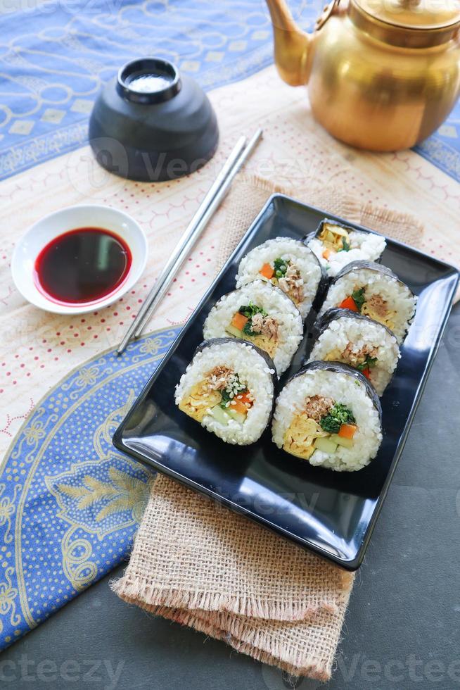 kimbap or gimbap is Korean roll Gimbap, kimbob made from steamed white rice bap and various other ingredients, this food from south korea photo