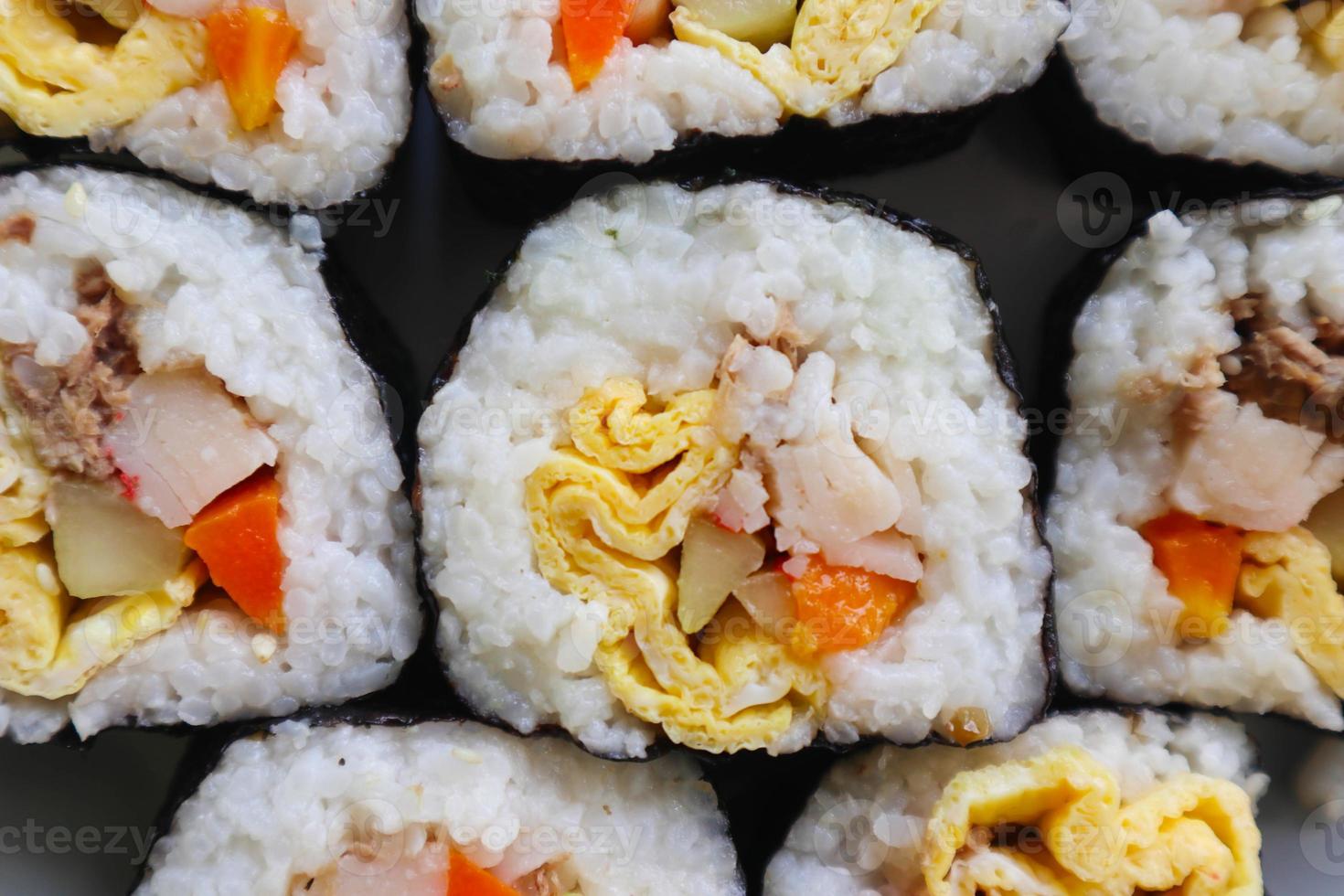 background kimbap or gimbap is Korean roll Gimbap kimbob made from steamed white rice bap and various other ingredients. photo