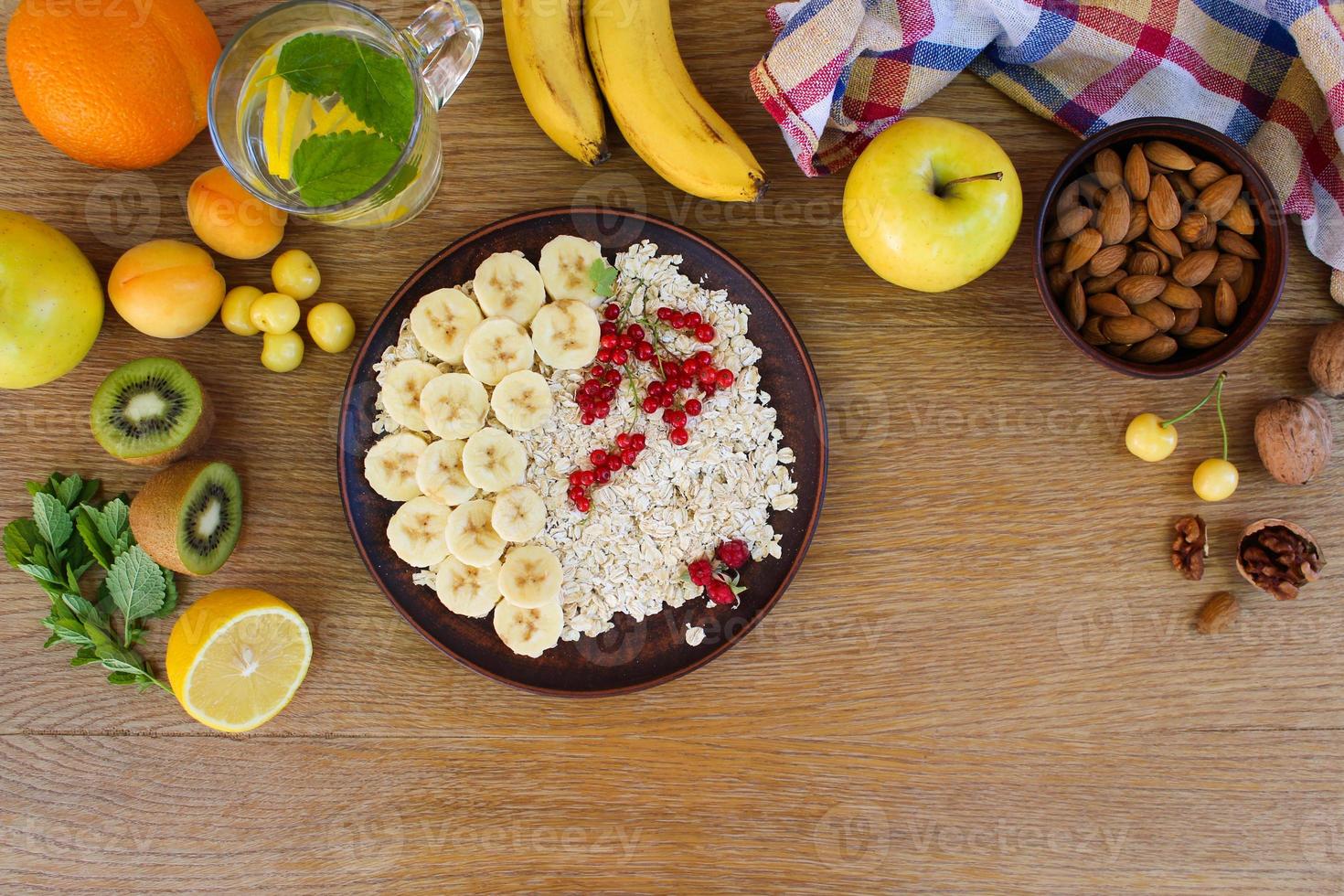 Oatmeal and fruit on the table. Healthy food. Proper nutrition. Top view. Flat lay. photo