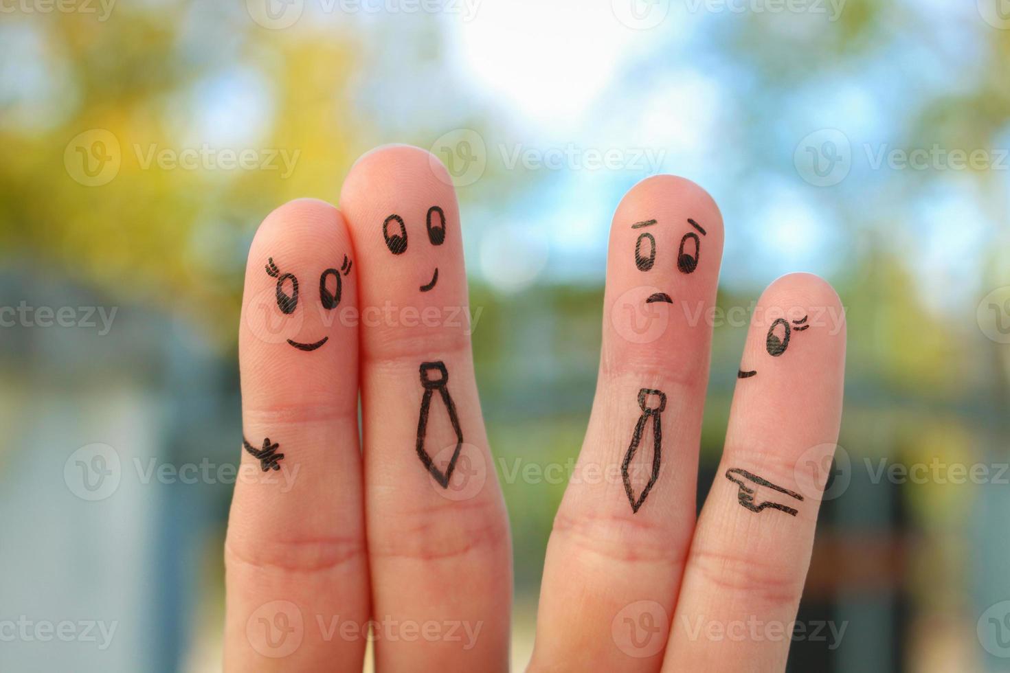 Fingers art of happy couple. Concept of office romance. People around laugh at them. photo