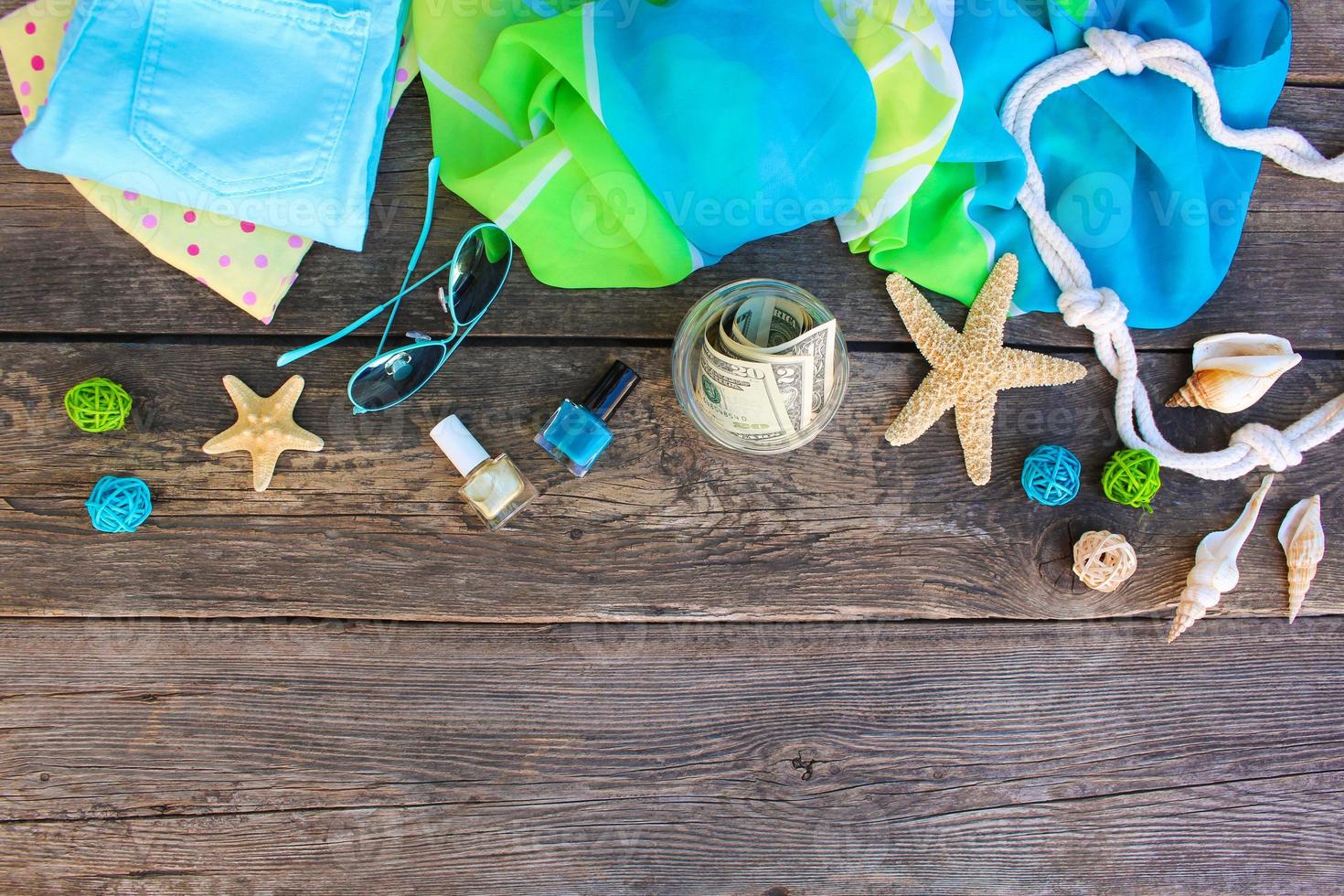 Dollars in glass jar. Concept of collecting money for journey. Top view, flat lay. photo