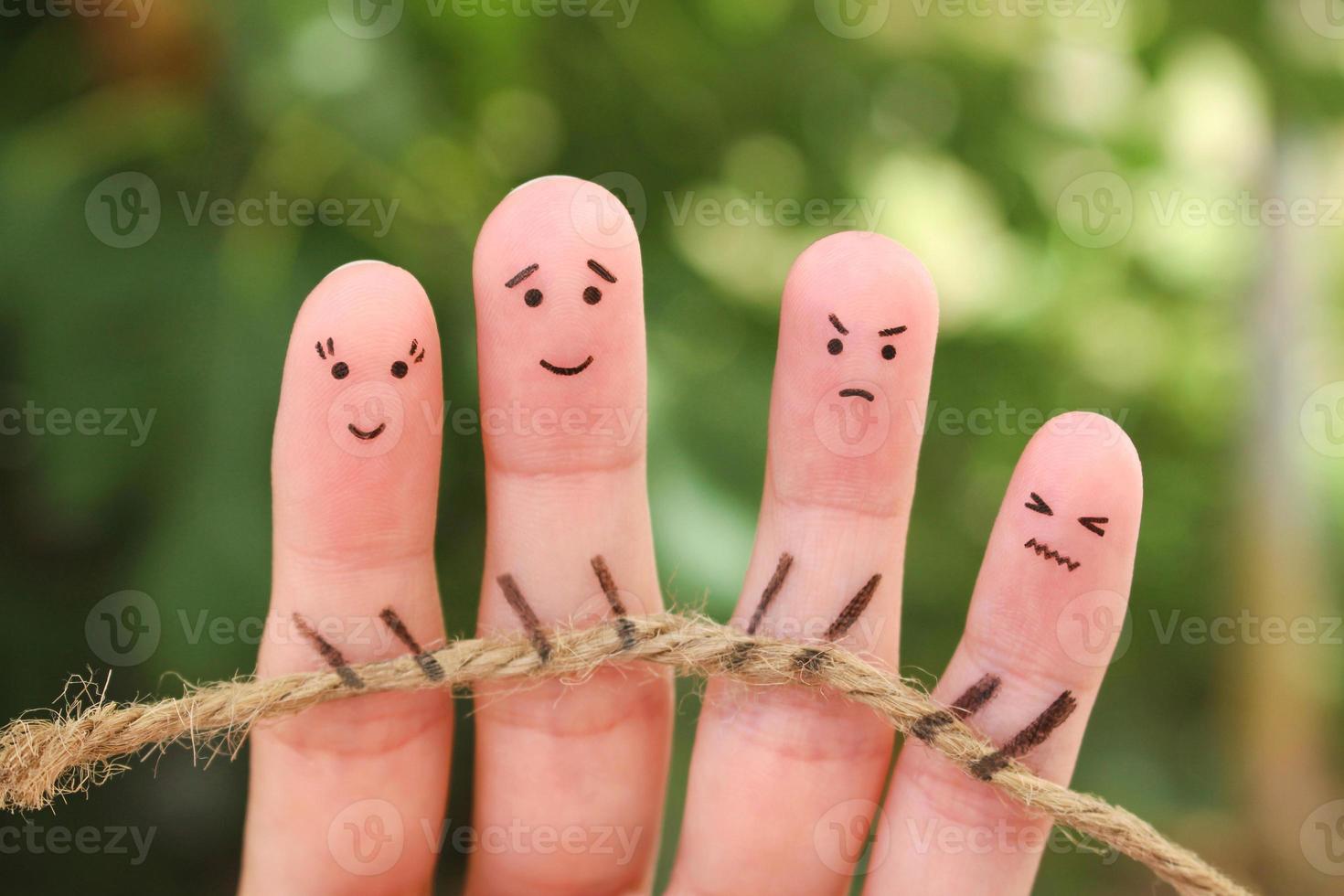 Fingers art of people. They playing tug of war with rope. photo